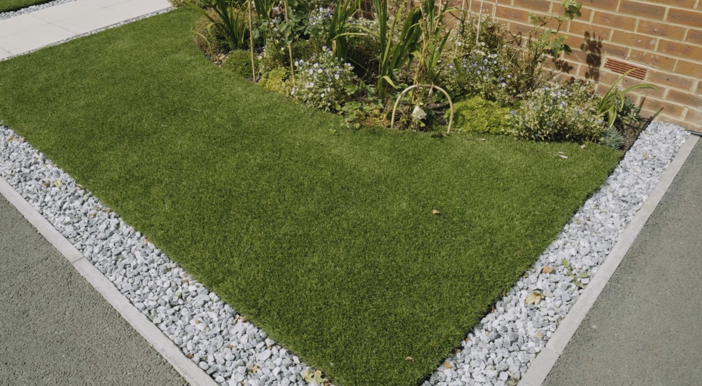 Water-saving artificial grass installation in Porterville residential yard